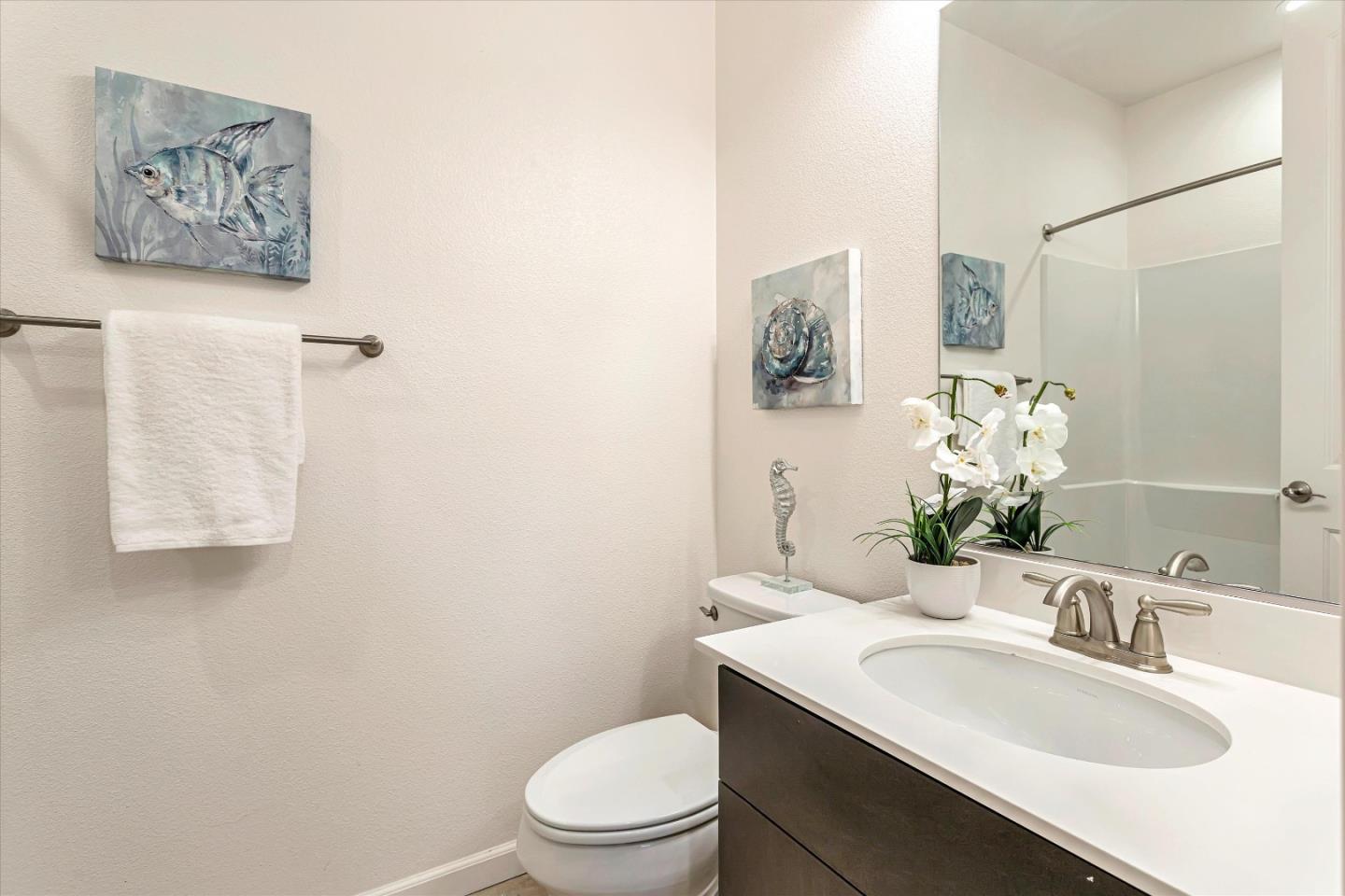 1886 Trento Loop Milpitas, CA 95035 - Photo 18 of 43 a bathroom with a sink toilet and mirror