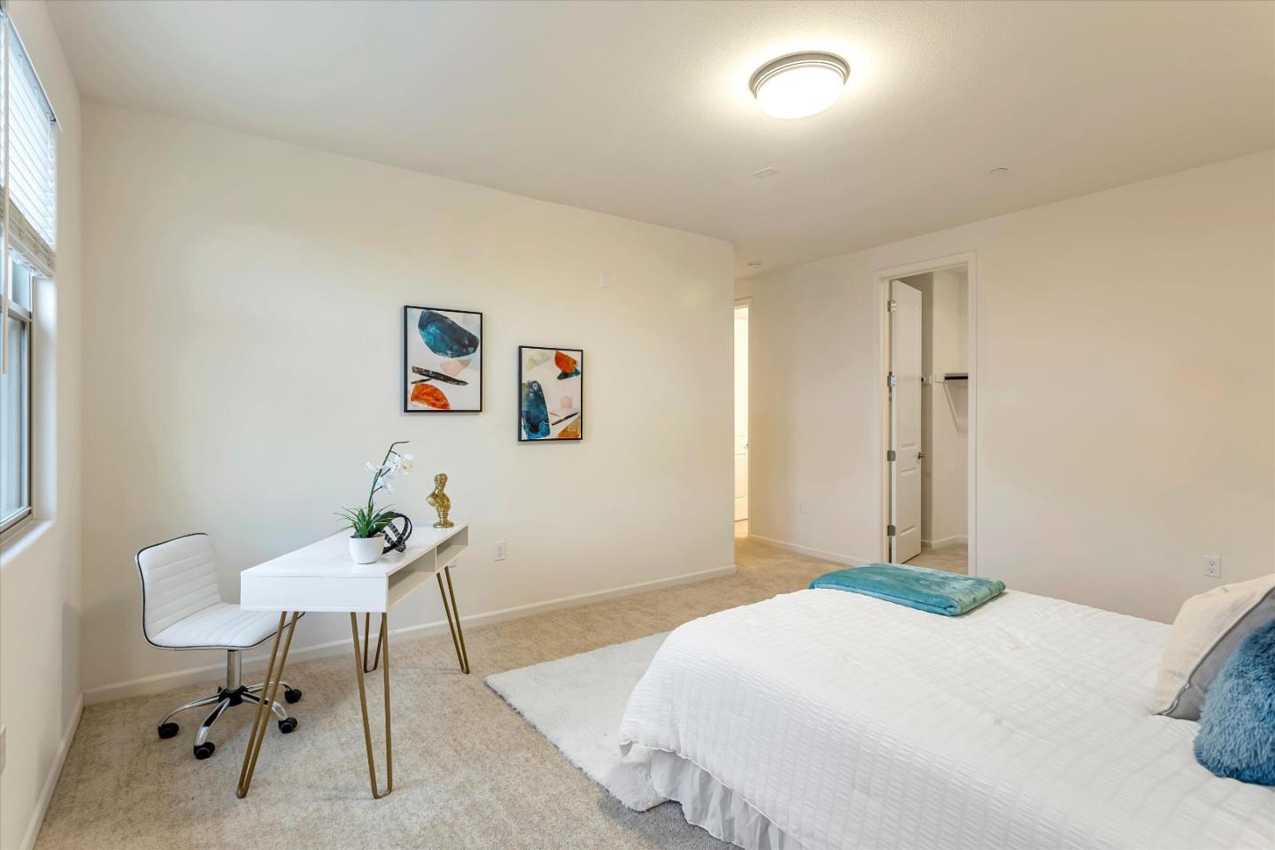 1886 Trento Loop Milpitas, CA 95035 - Photo 21 of 43 a bedroom with a bed and a table in it