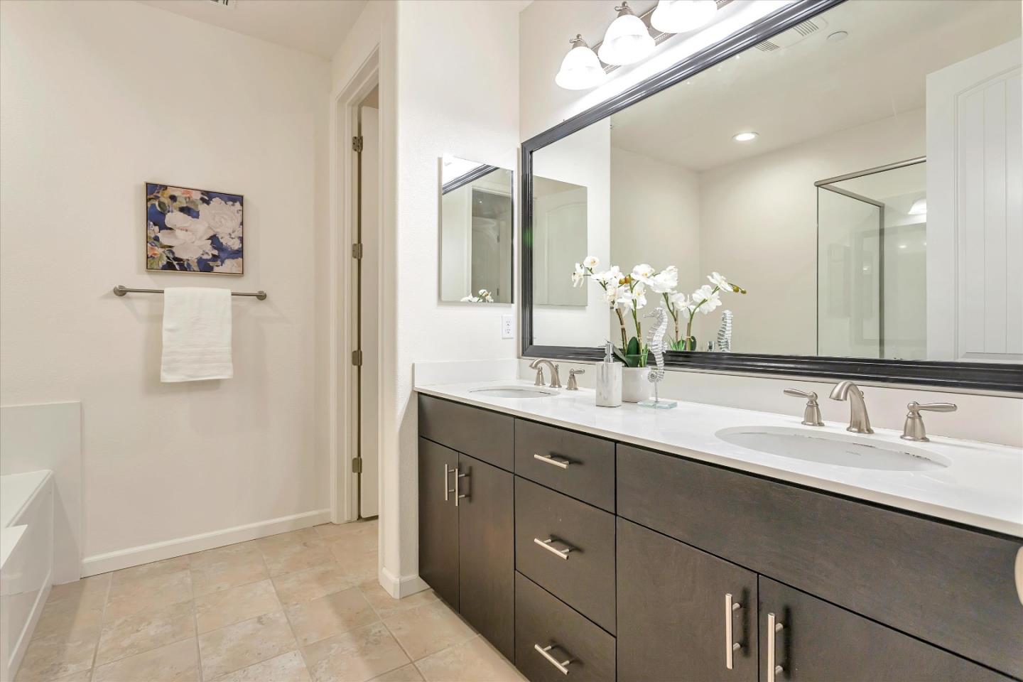 1886 Trento Loop Milpitas, CA 95035 - Photo 22 of 43 a bathroom with a double vanity sink and a mirror