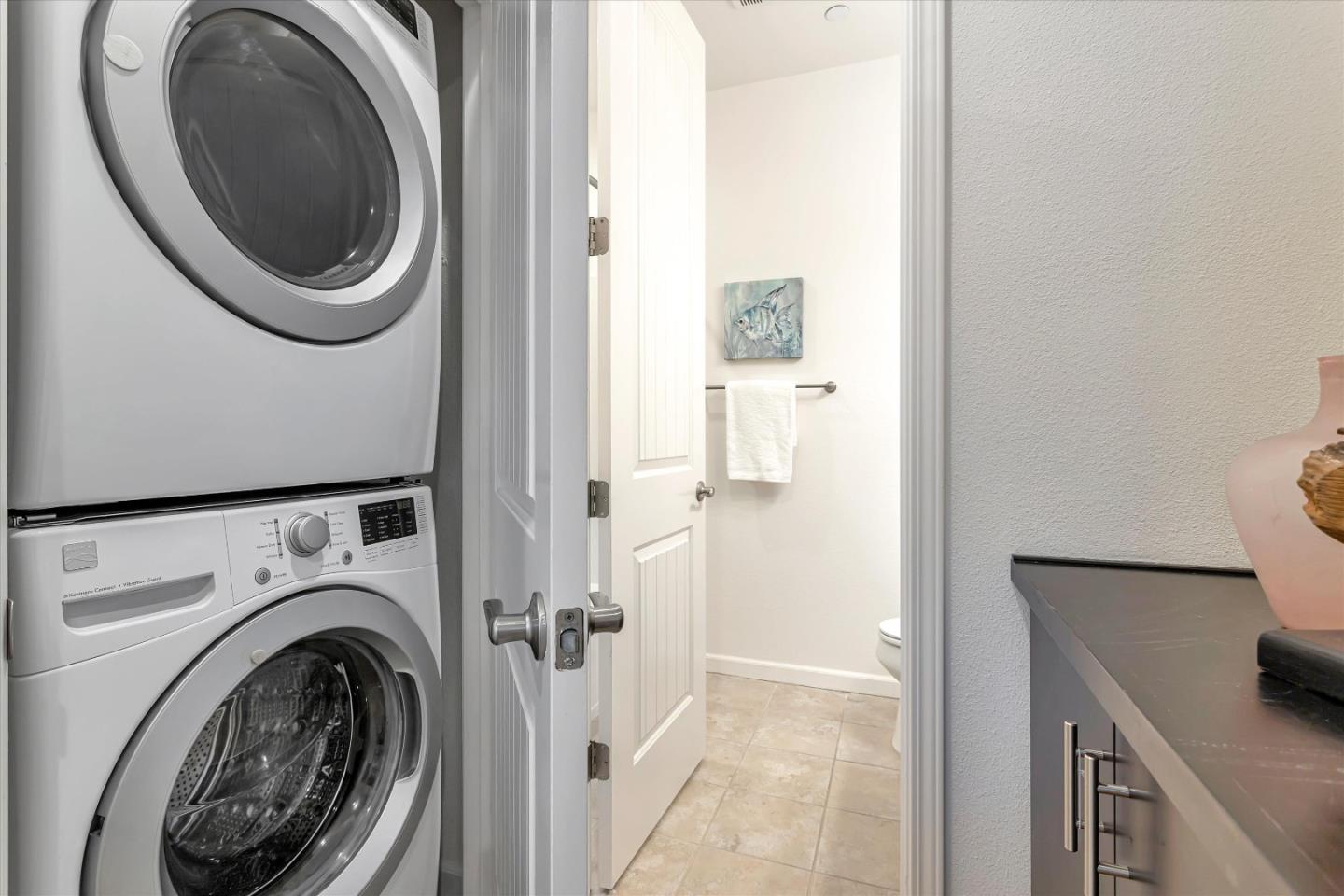 1886 Trento Loop Milpitas, CA 95035 - Photo 27 of 43 a view of a hallway with washer and dryer