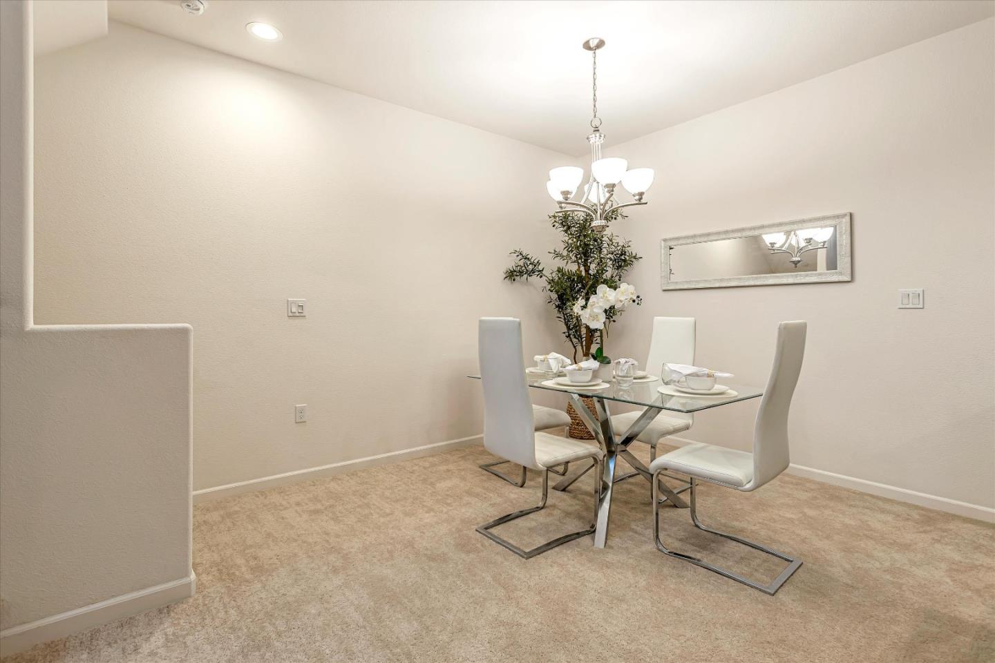 1886 Trento Loop Milpitas, CA 95035 - Photo 10 of 43 a dining room with furniture and chandelier