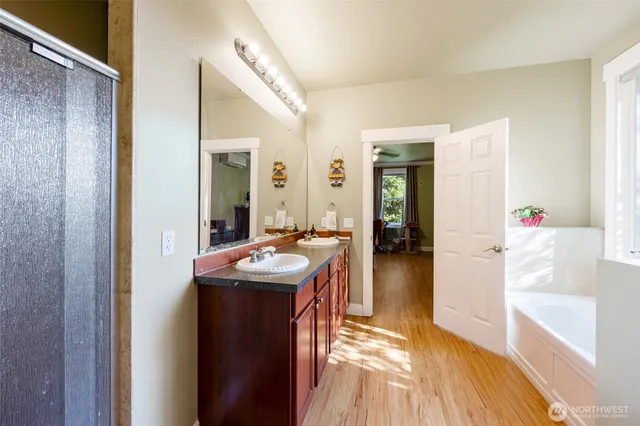 a en suite bathroom with sink and mirror