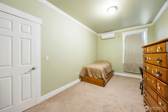 a bedroom with a bed and a cabinets