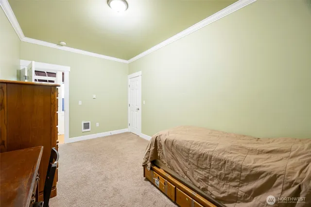 a bedroom with a bed and a cabinets