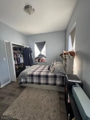 a bedroom with bed and window
