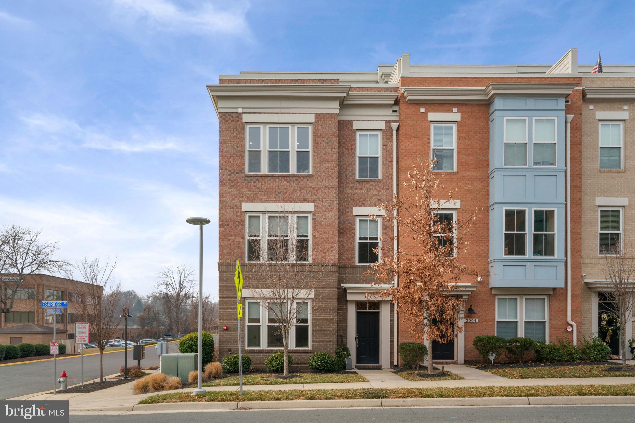 3006 Eskridge Road Fairfax, VA 22031 - Photo 2 of 41 a front view of a building with lot of cars and trees