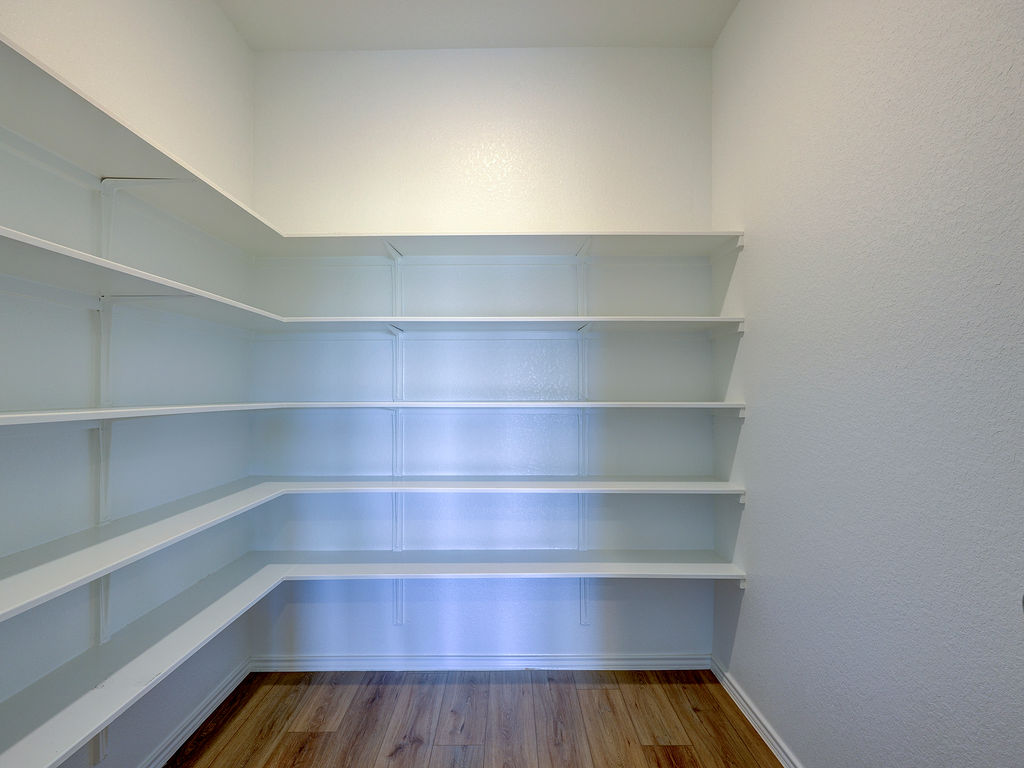 1716 Frontenac Street Leander, TX 78641 - Photo 11 of 34 a view of a room with shelf on the wall