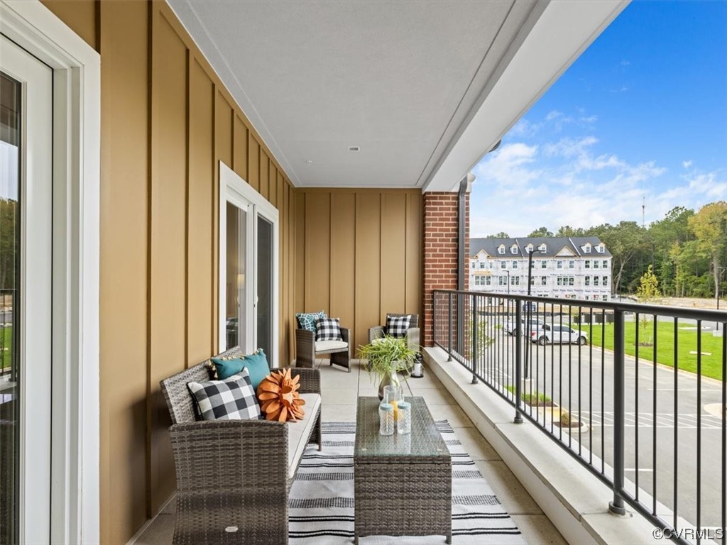 1532 Ewing Park Loop Midlothian, VA 23113 - Photo 10 of 24 a balcony with furniture and a potted plant