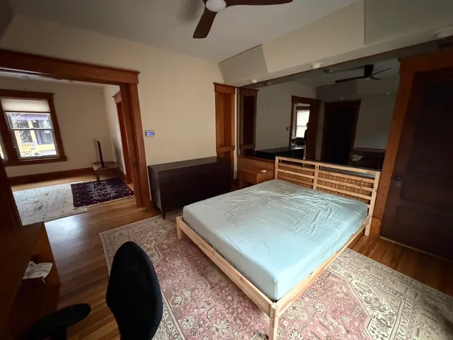 a room with pool and wooden floor