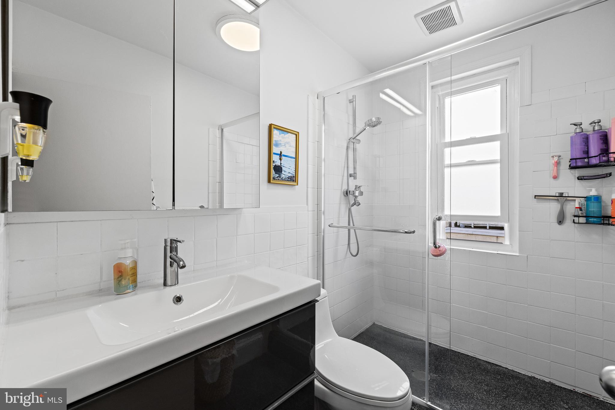 726 South 19th Street Philadelphia, PA 19146 - Photo 9 of 12 a bathroom with a sink toilet and shower