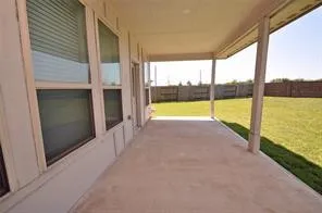 a view of an empty room and window with an ocean view