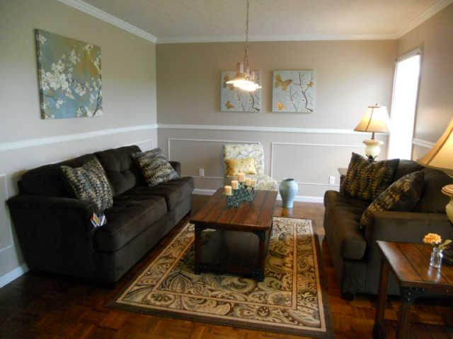 2778 Battle Creek Road Springfield, TN 37172 - Photo 4 of 20 a living room with furniture and a painting on the wall