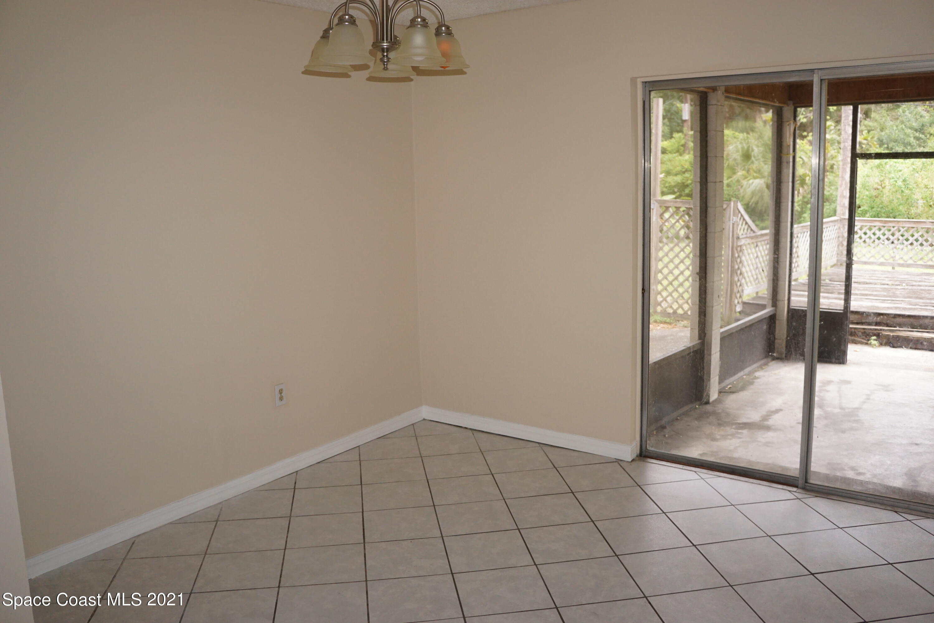 1052 Bernice Road Rockledge, FL 32955 - Photo 11 of 39 a view of an empty room and window
