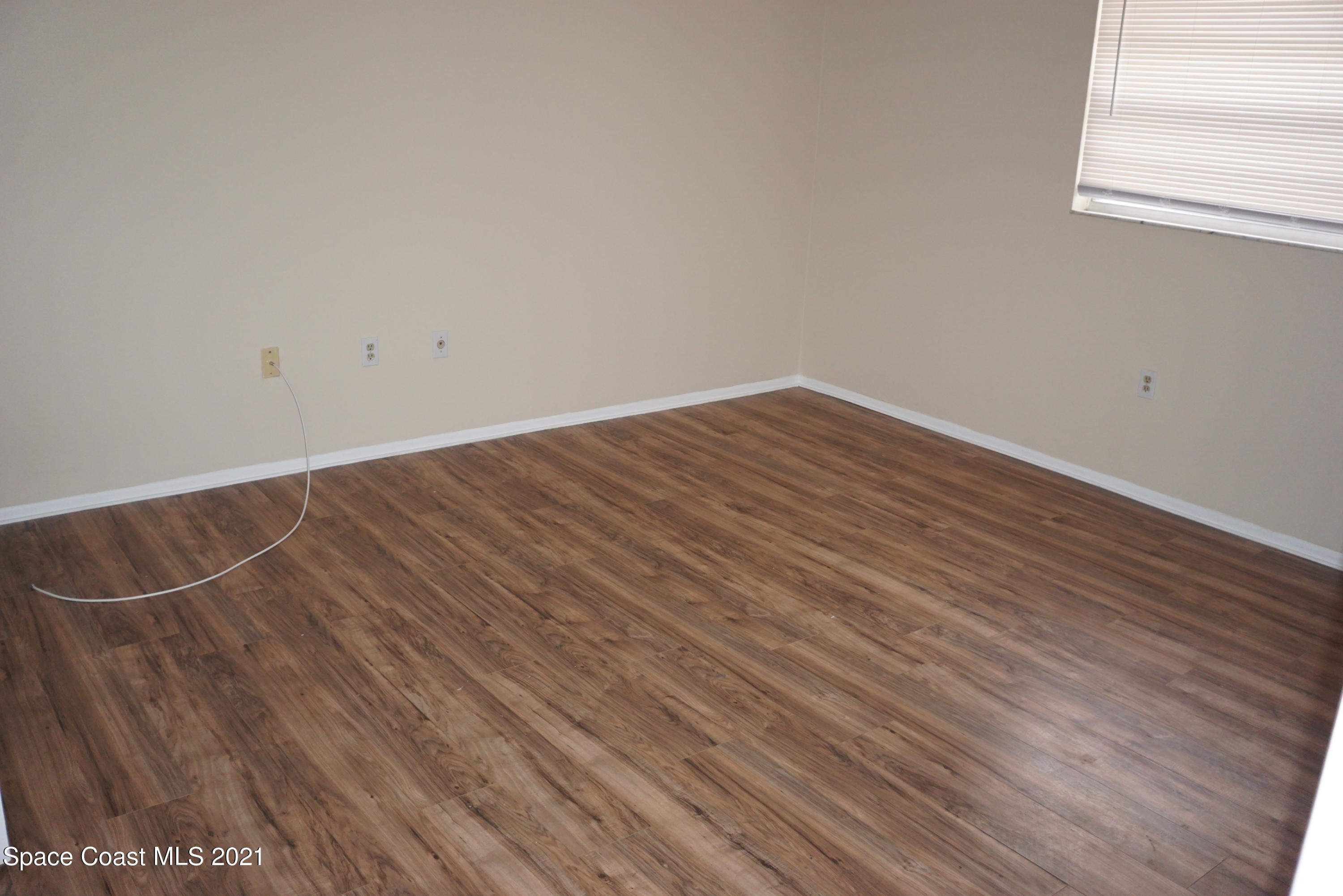 1052 Bernice Road Rockledge, FL 32955 - Photo 20 of 39 a view of a room with wooden floor