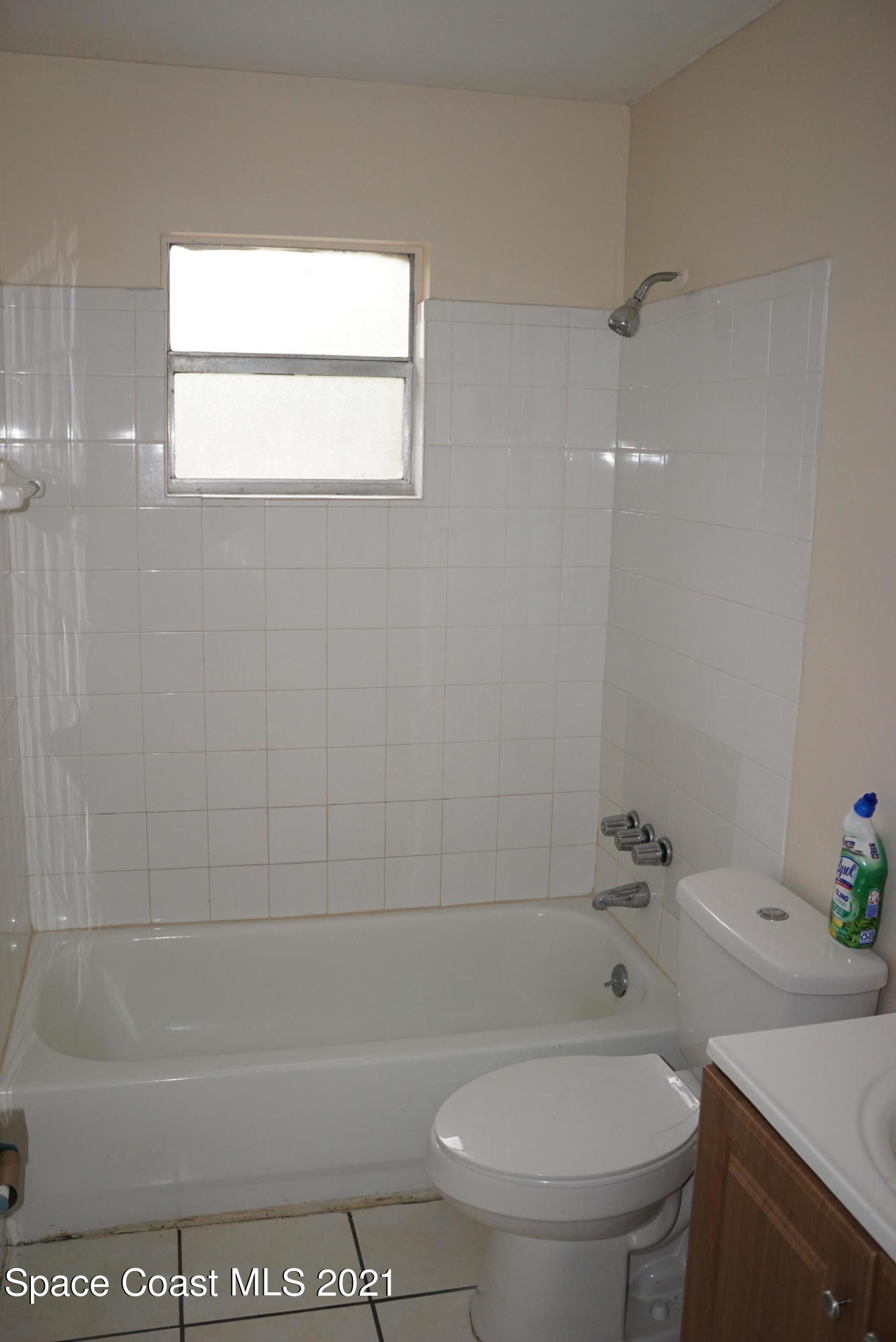 1052 Bernice Road Rockledge, FL 32955 - Photo 30 of 39 a bathroom with a toilet a sink and bathtub