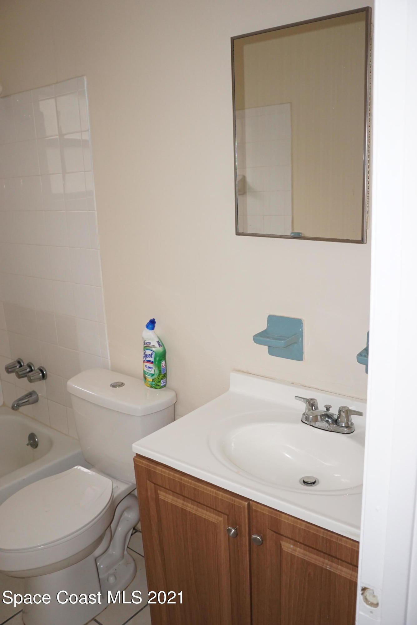 1052 Bernice Road Rockledge, FL 32955 - Photo 31 of 39 a bathroom with a sink a toilet and tub