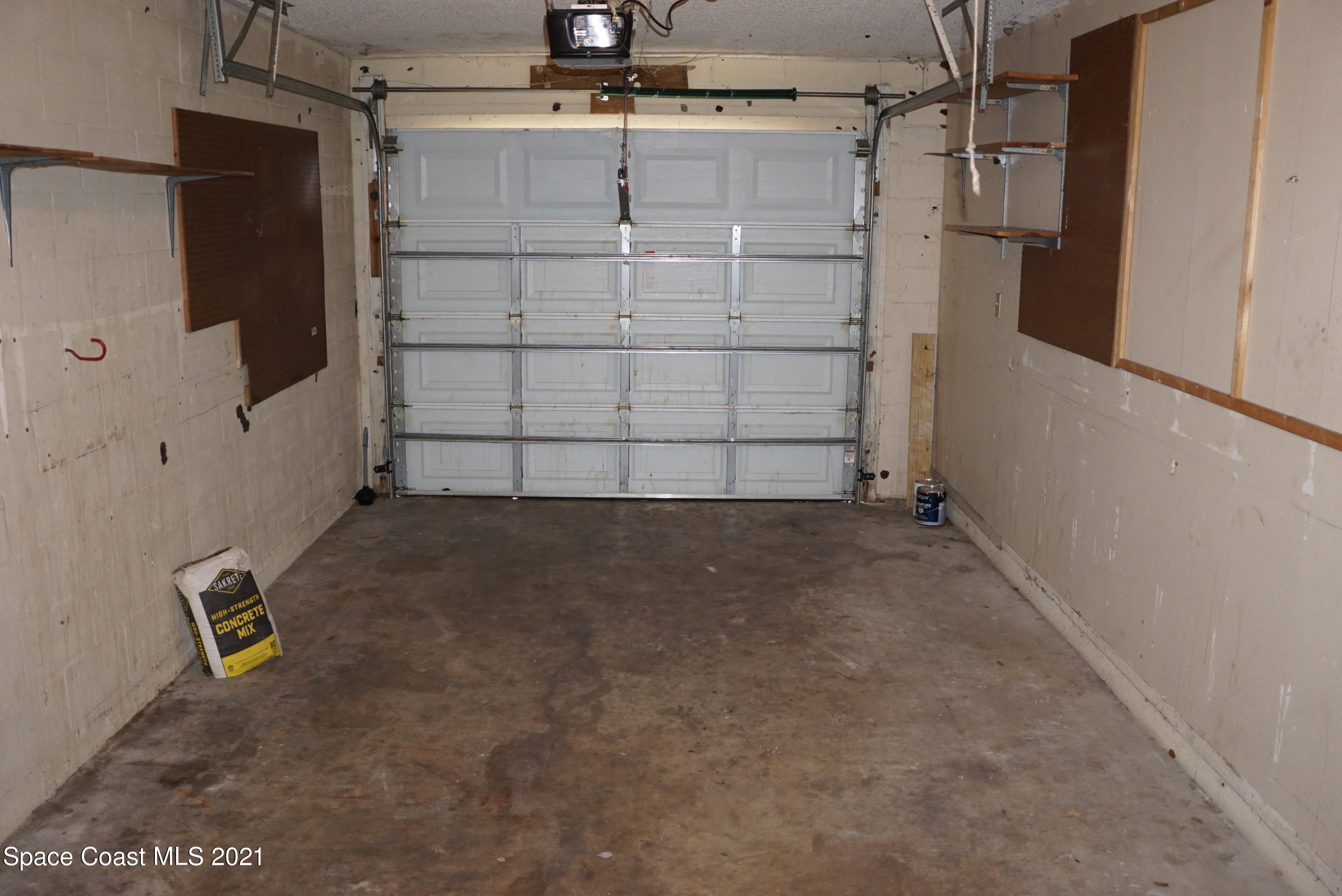 1052 Bernice Road Rockledge, FL 32955 - Photo 32 of 39 a view of storage and utility room with wooden floor