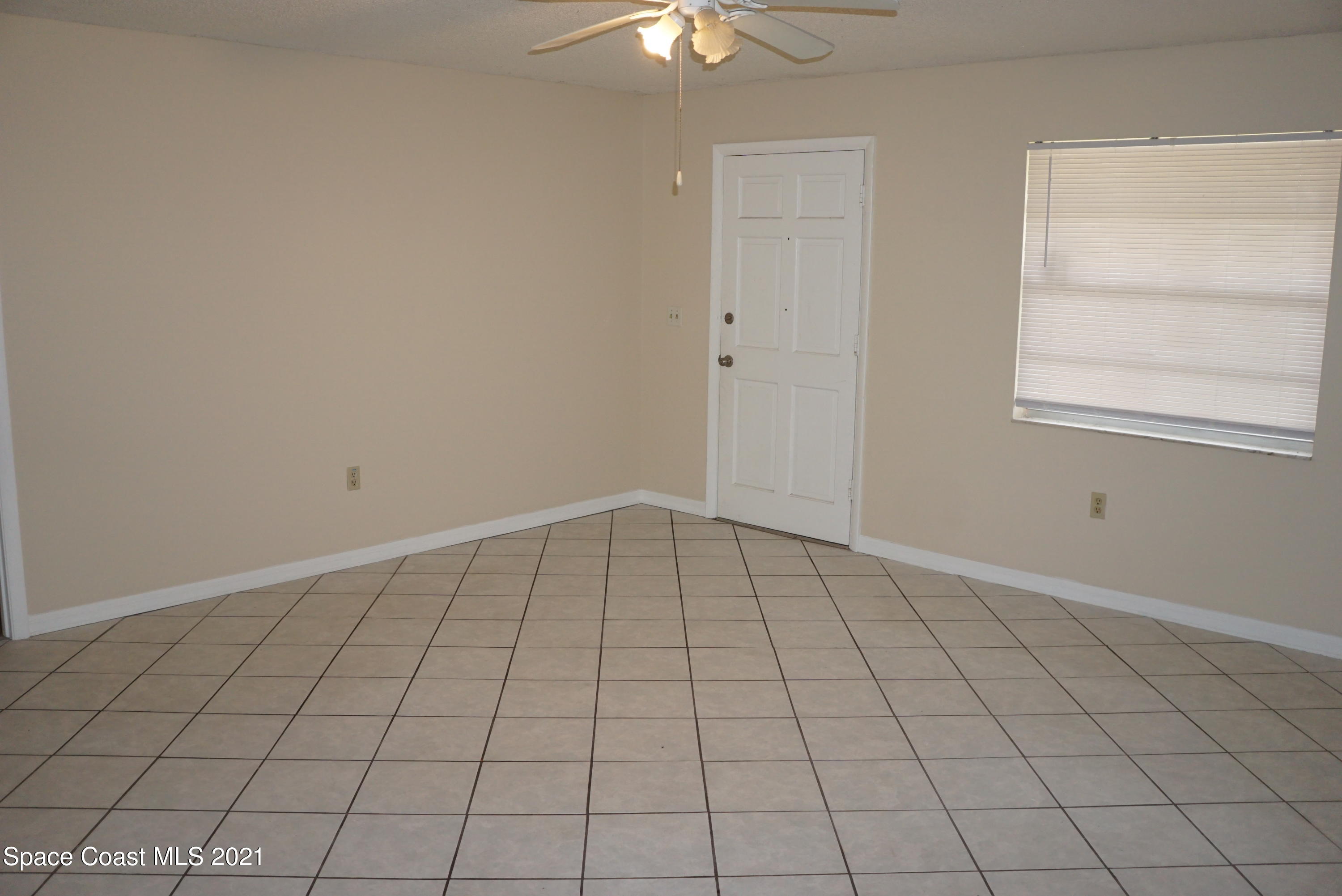 1052 Bernice Road Rockledge, FL 32955 - Photo 7 of 39 a view of an empty room and window