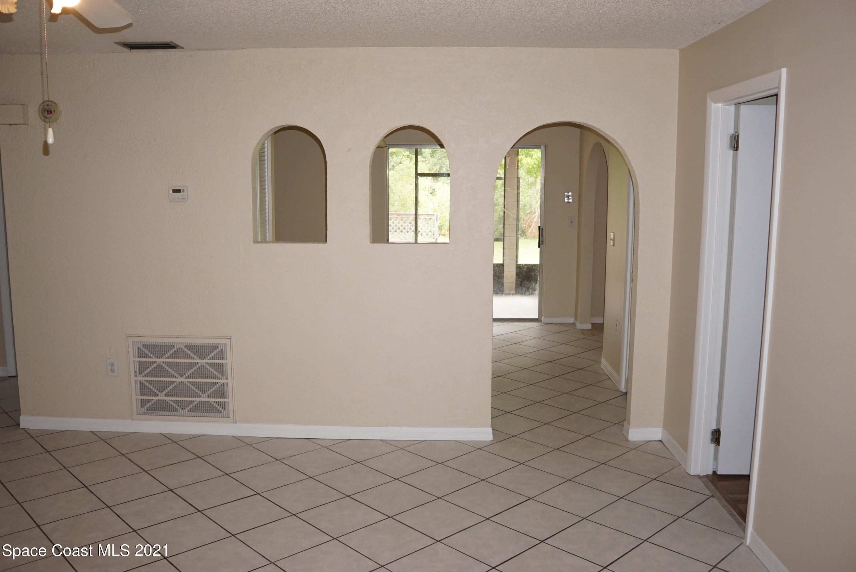 1052 Bernice Road Rockledge, FL 32955 - Photo 8 of 39 a view of an entryway with a door