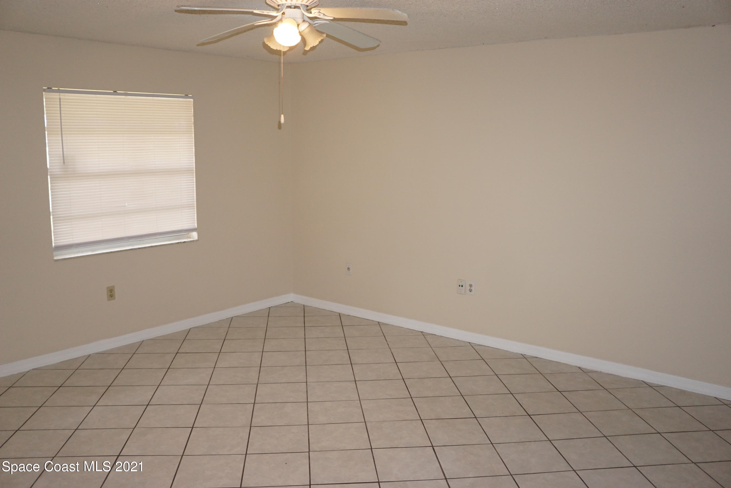 1052 Bernice Road Rockledge, FL 32955 - Photo 10 of 39 an empty room with windows