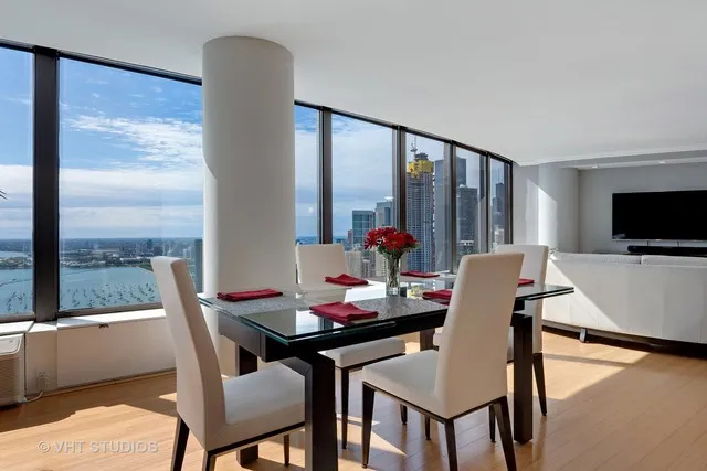 a view of a dining room with furniture window and outside view