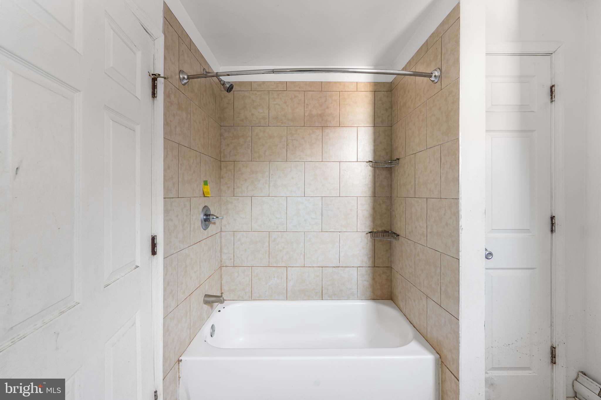 5215 Chester Avenue Philadelphia, PA 19143 - Photo 13 of 19 a bathroom with a bathtub