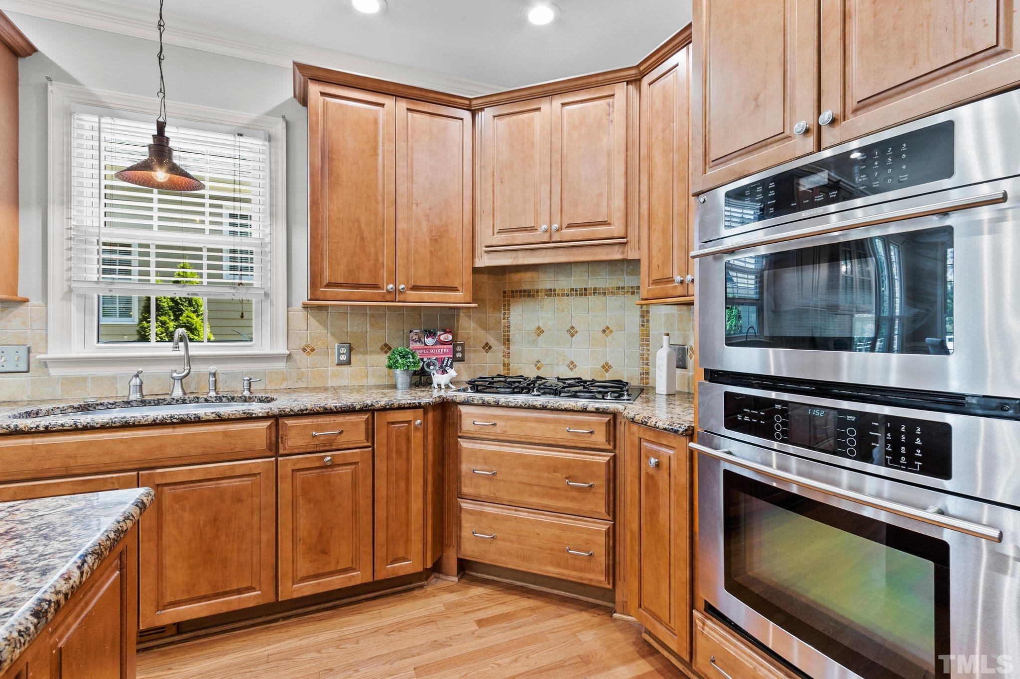 269 Hogans Valley Way Cary, NC 27513 - Photo 13 of 42 a kitchen with granite countertop cabinets stainless steel appliances and a sink