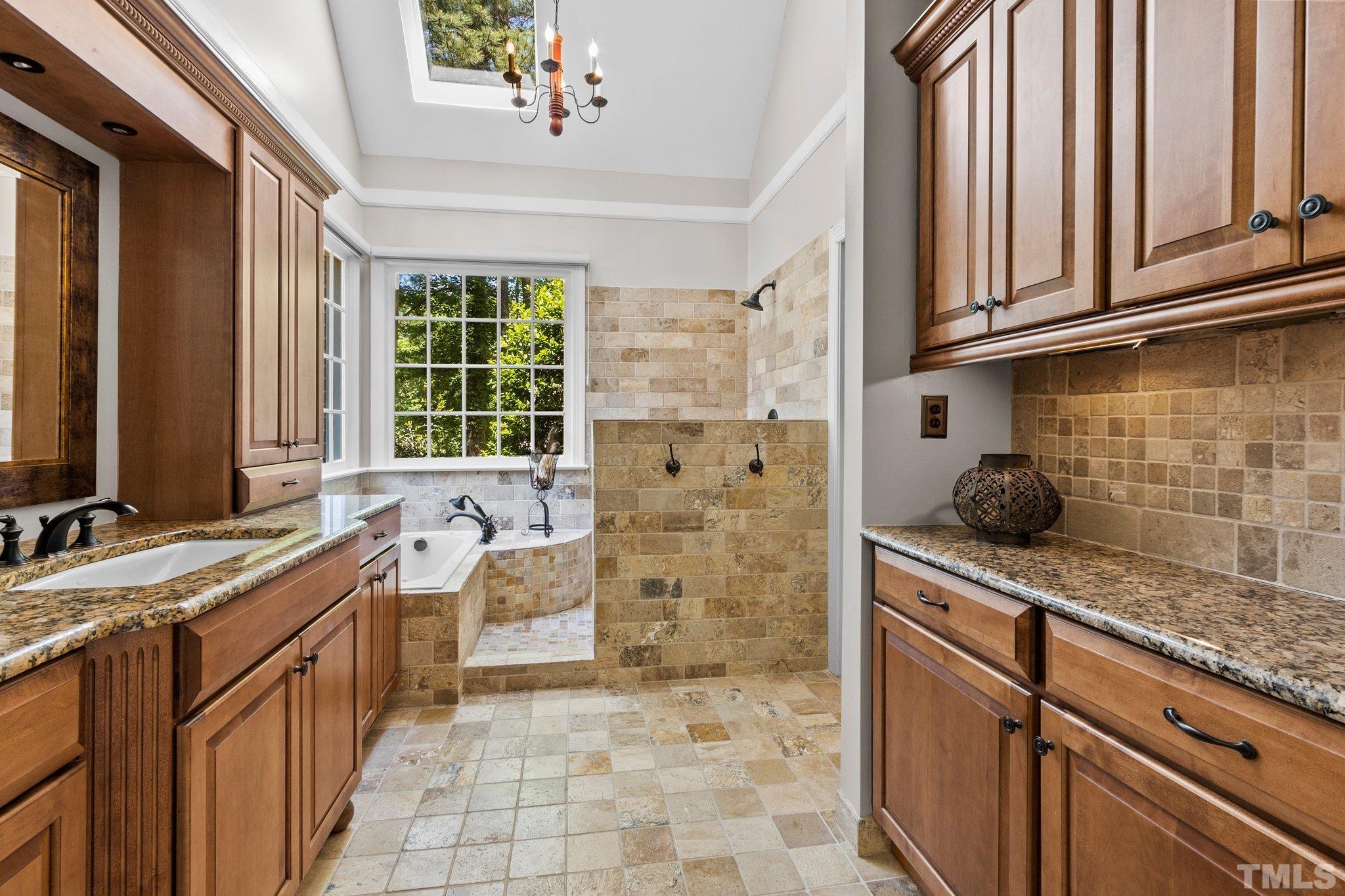 269 Hogans Valley Way Cary, NC 27513 - Photo 18 of 42 a bathroom with a granite countertop sink a toilet and shower