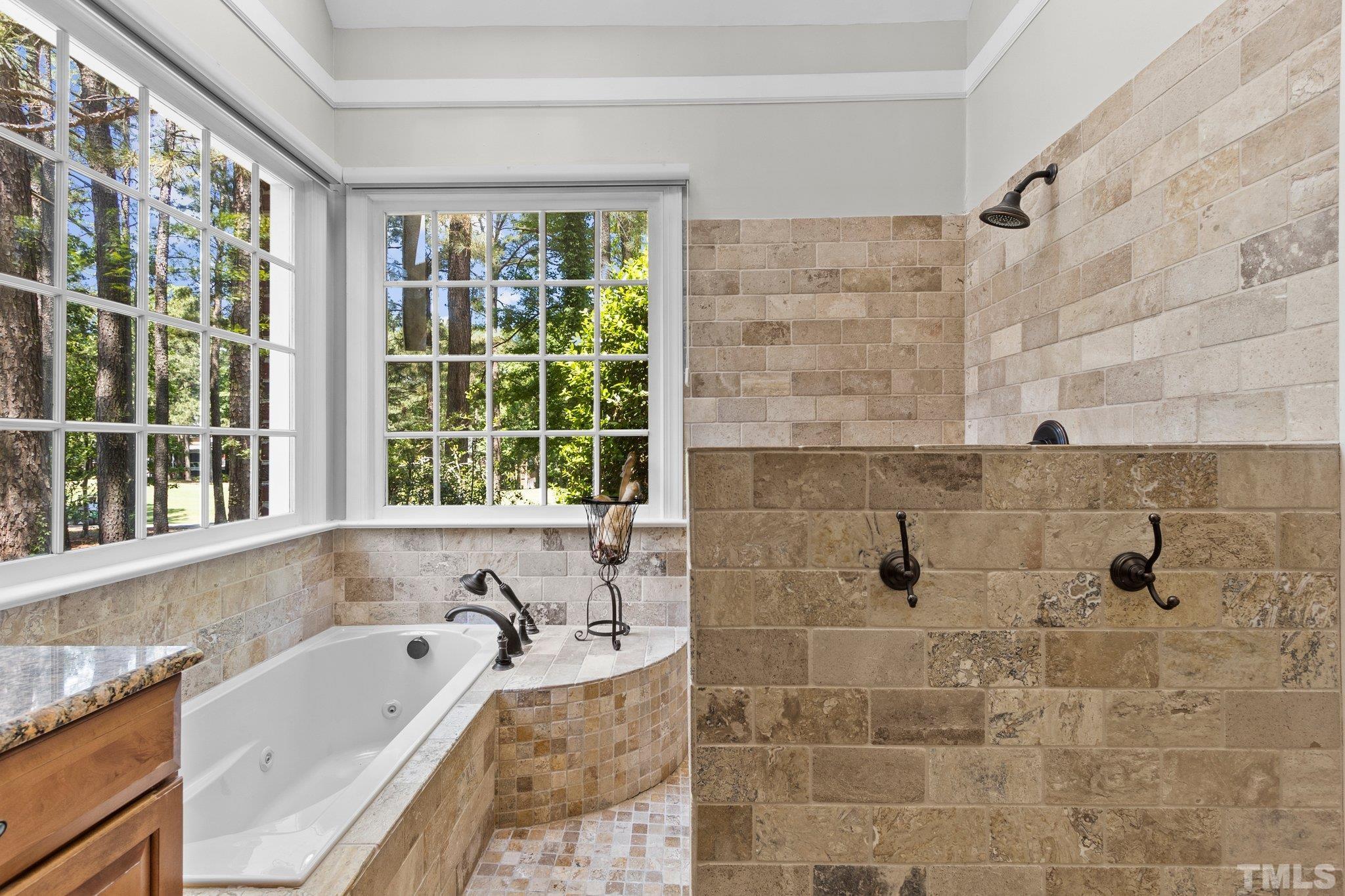 269 Hogans Valley Way Cary, NC 27513 - Photo 19 of 42 a bathroom with a bathtub and a sink