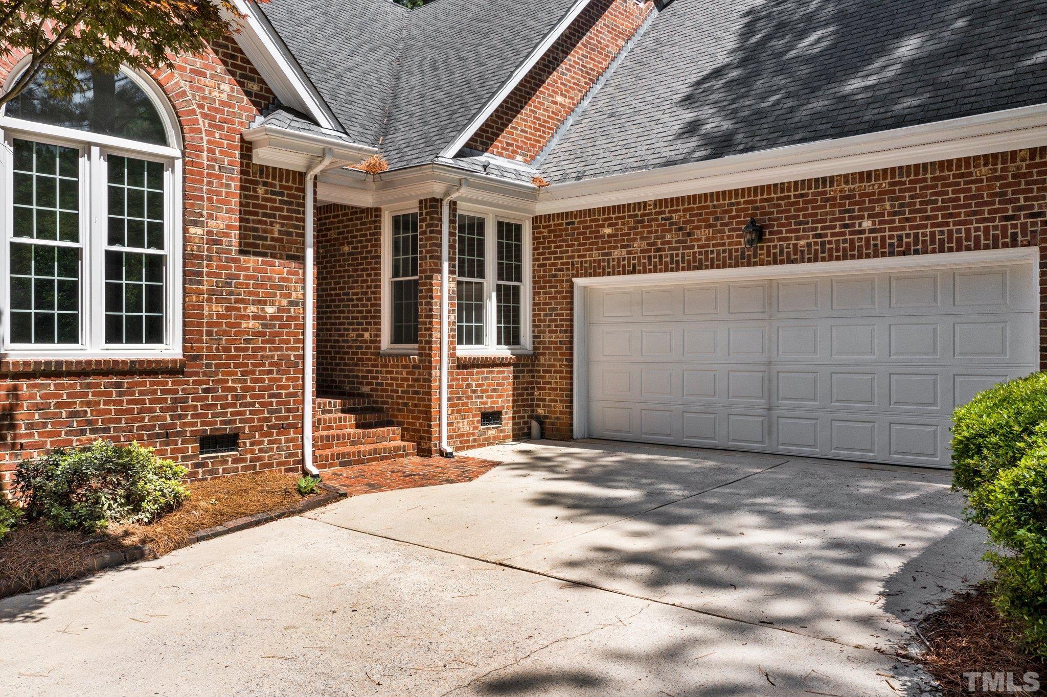 269 Hogans Valley Way Cary, NC 27513 - Photo 2 of 42 a front view of a house with a garage