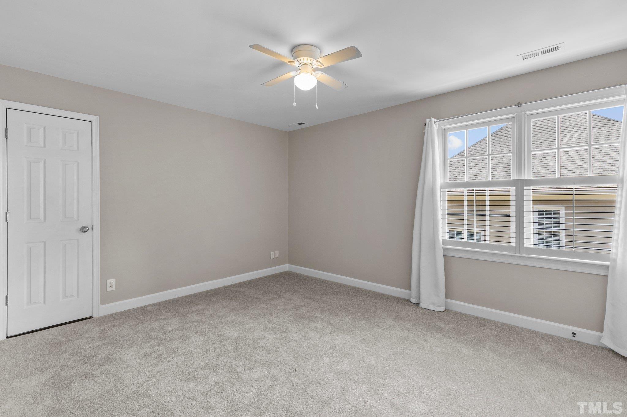 269 Hogans Valley Way Cary, NC 27513 - Photo 24 of 42 a view of an empty room with a window