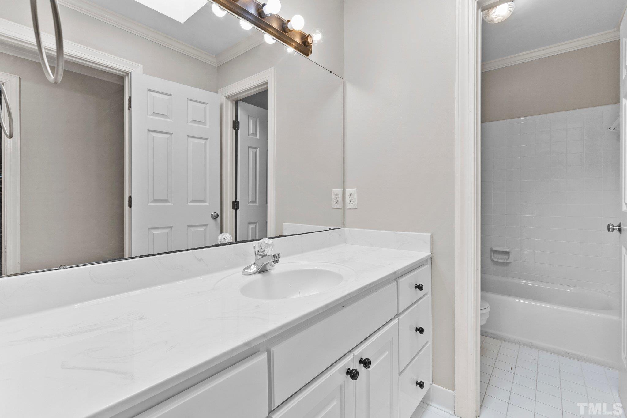 269 Hogans Valley Way Cary, NC 27513 - Photo 25 of 42 a bathroom with a sink and a bathtub