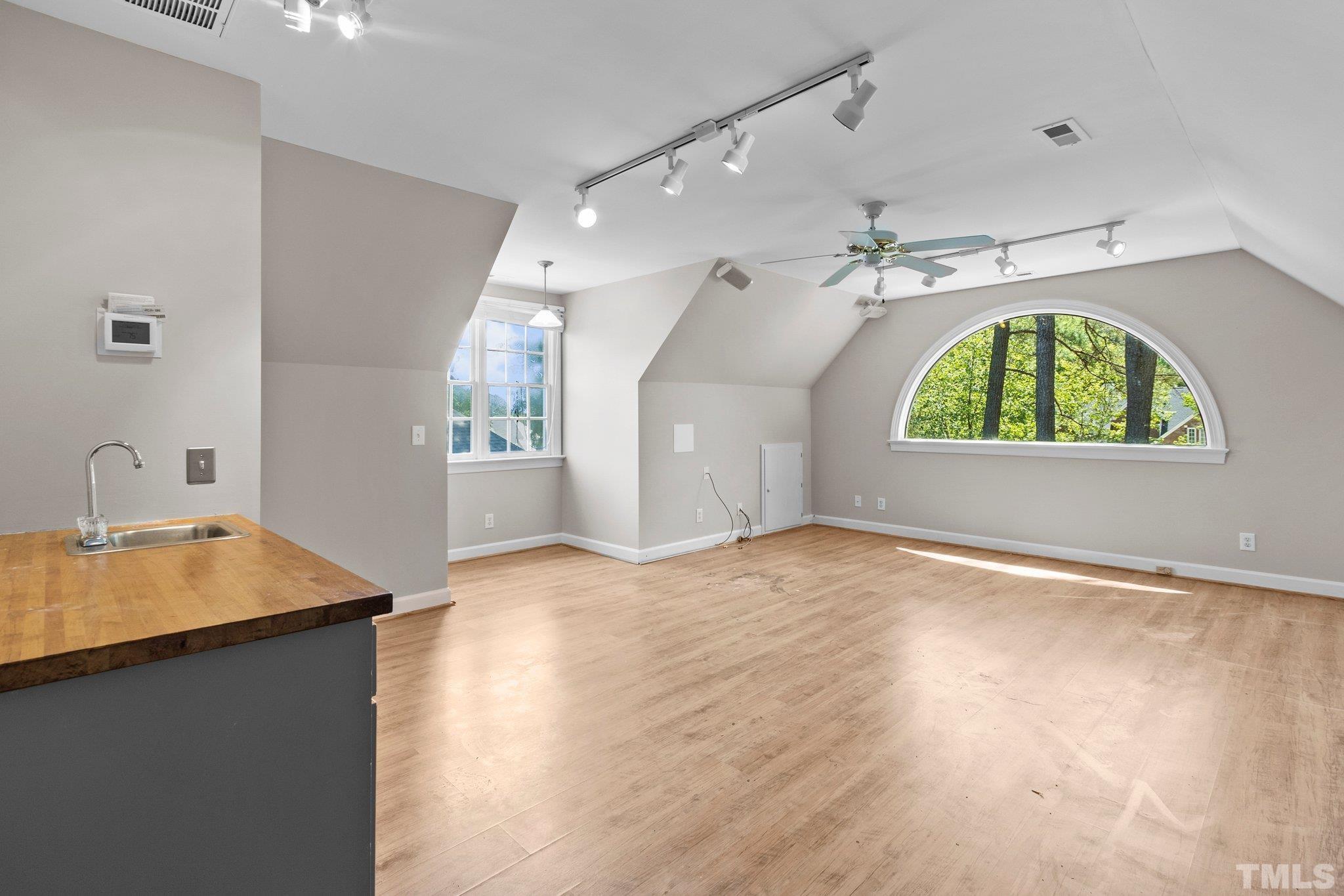 269 Hogans Valley Way Cary, NC 27513 - Photo 28 of 42 an empty room with a fireplace and wooden floor