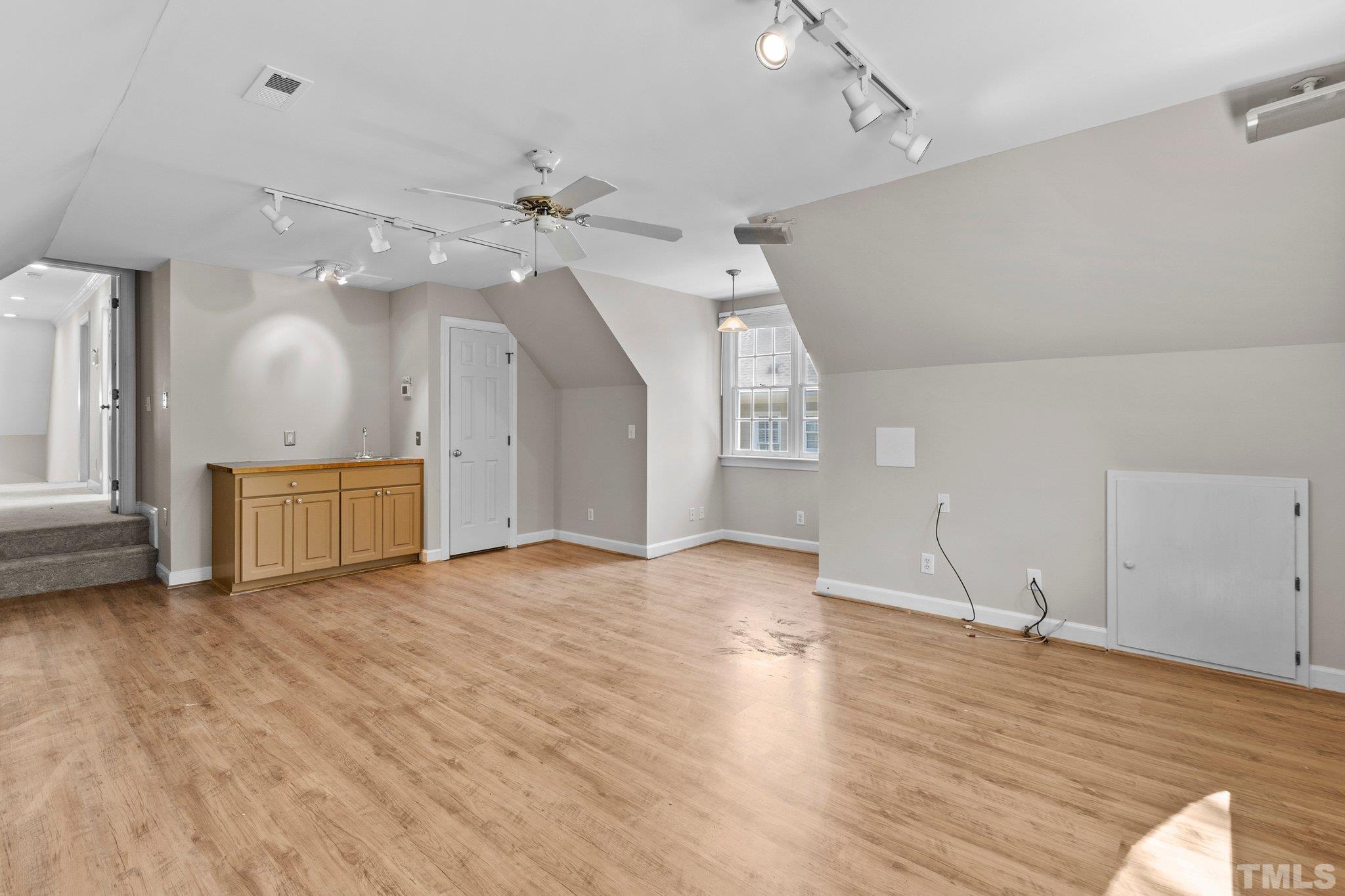 269 Hogans Valley Way Cary, NC 27513 - Photo 29 of 42 a view of an empty room with a window and wooden floor