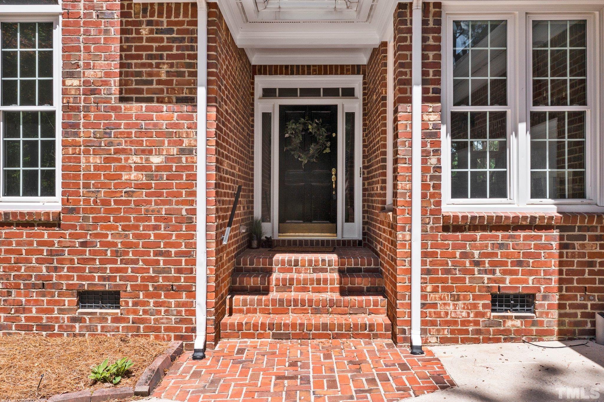 269 Hogans Valley Way Cary, NC 27513 - Photo 4 of 42 a front view of a house with a door