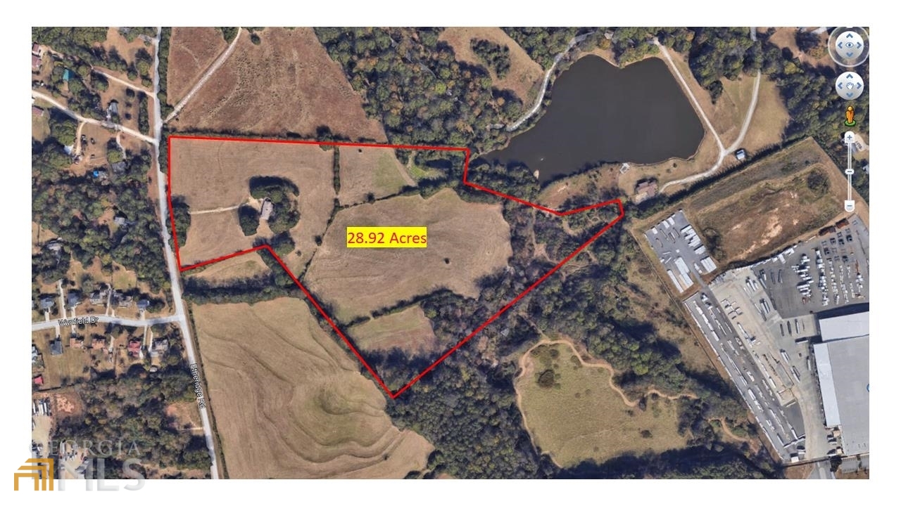 189 Etheridge Road Auburn, GA 30011 - Photo 1 of 7 a view of a backyard with a tree