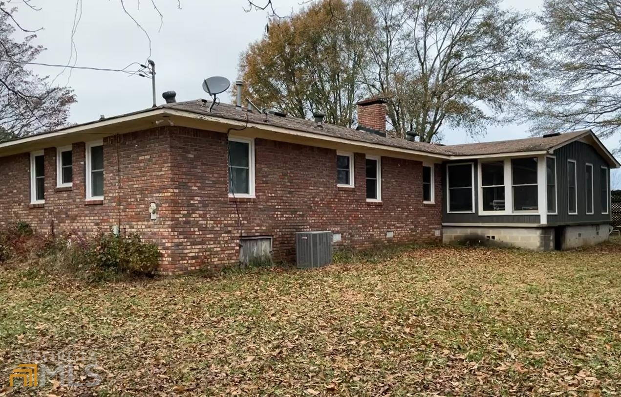 189 Etheridge Road Auburn, GA 30011 - Photo 5 of 7 a front view of a house with garden