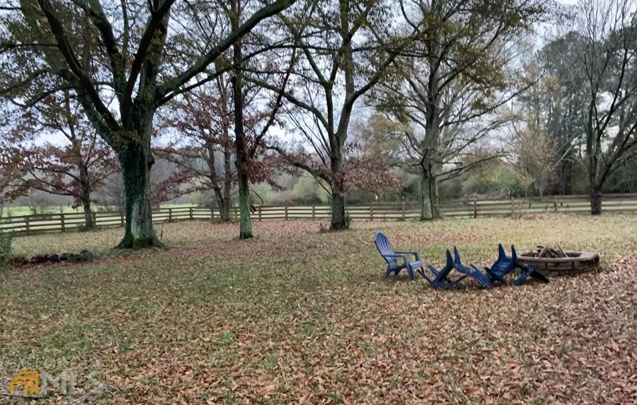 189 Etheridge Road Auburn, GA 30011 - Photo 6 of 7 a view of a yard with table and chairs