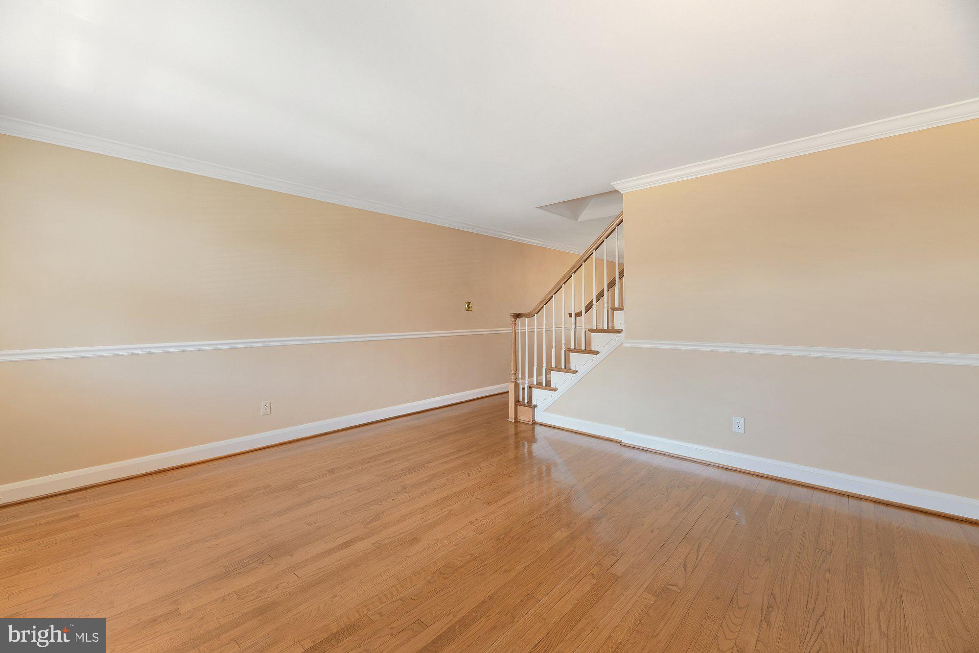 1916 Church Road Baltimore, MD 21222 - Photo 3 of 34 a view of an empty room with wooden floor and white walls