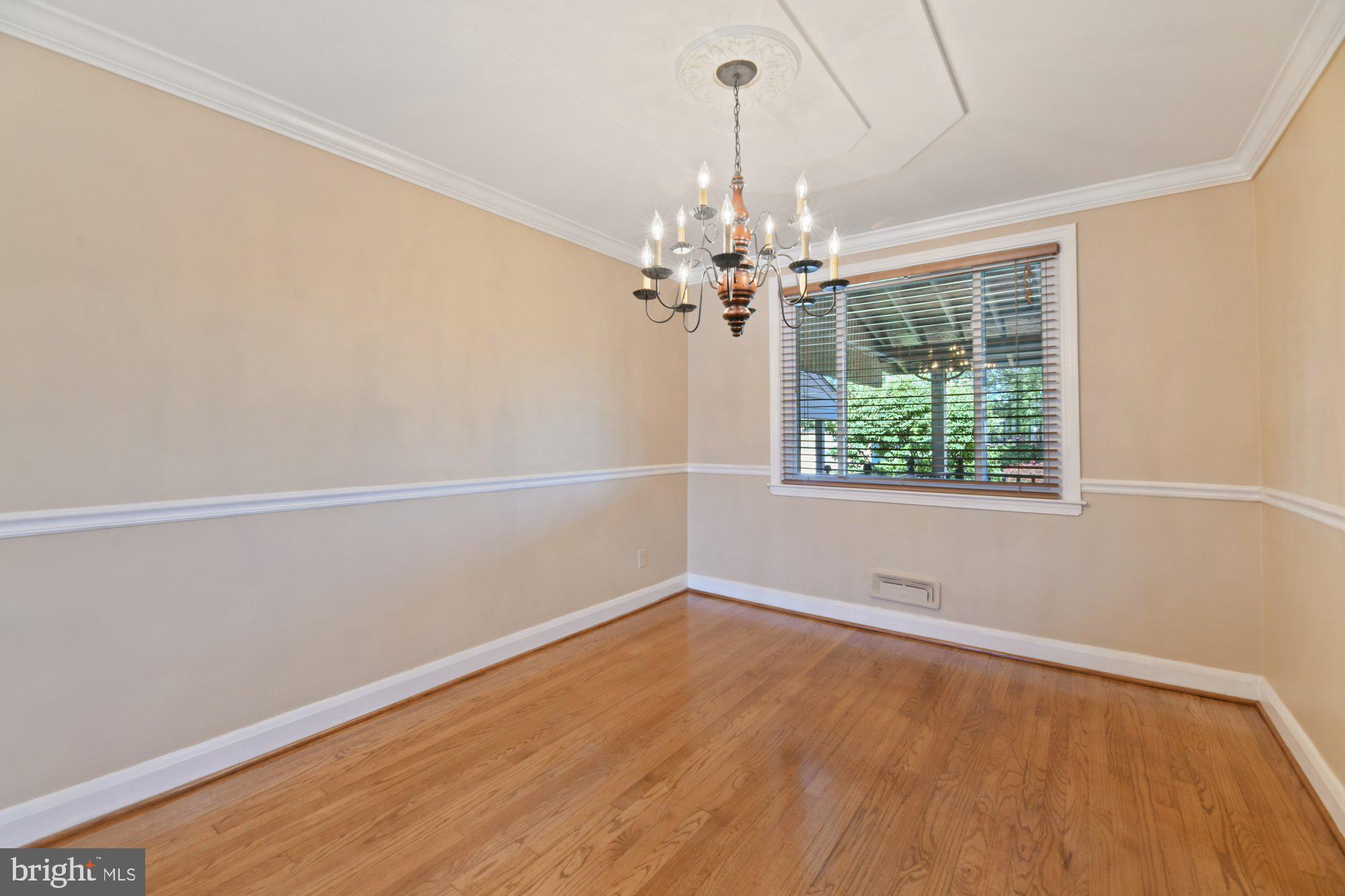 1916 Church Road Baltimore, MD 21222 - Photo 7 of 34 wooden floor in an empty room with a window