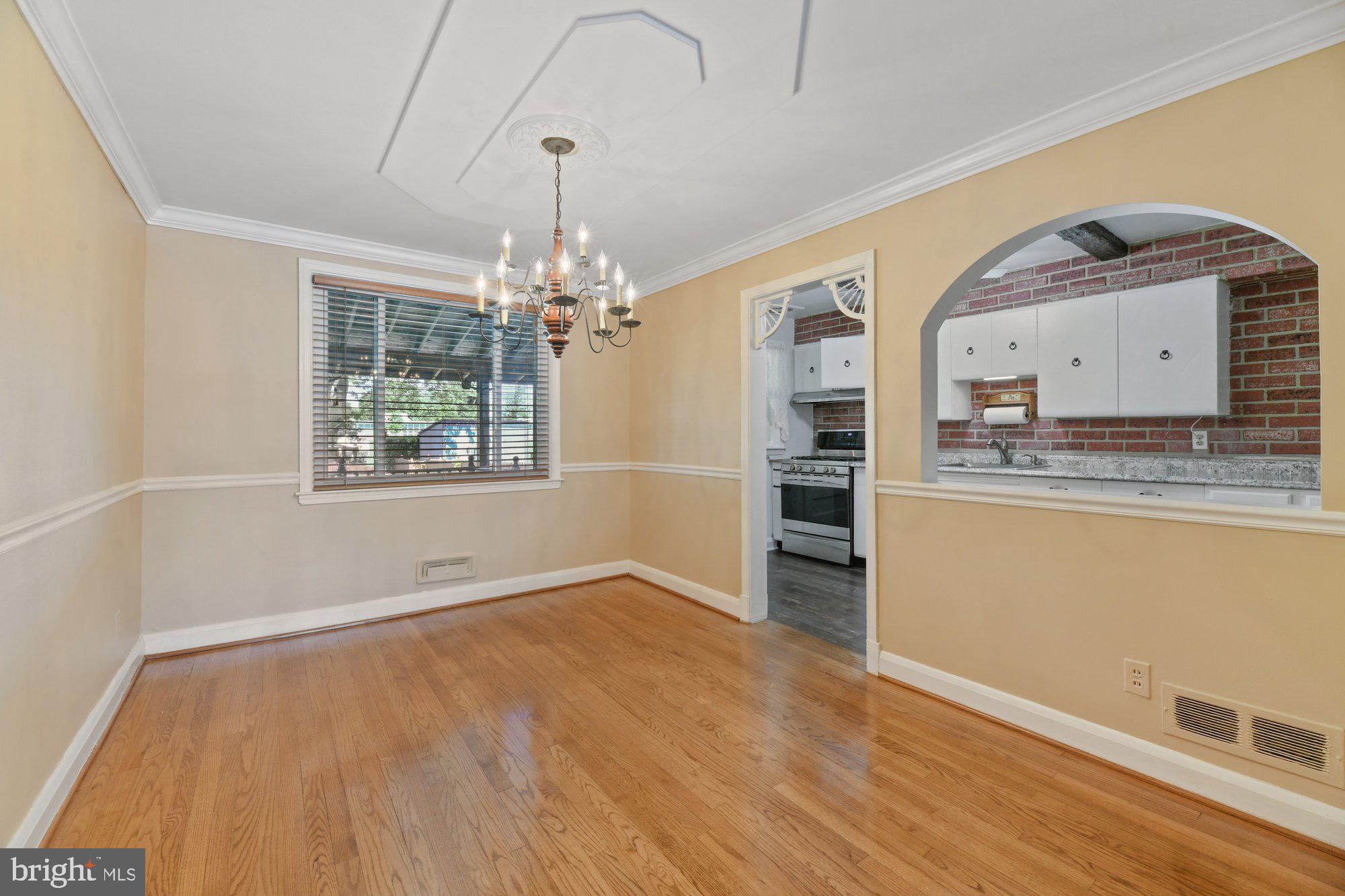 1916 Church Road Baltimore, MD 21222 - Photo 8 of 34 wooden floor in an empty room with a window