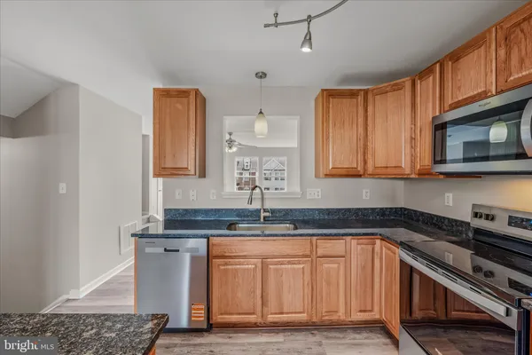 a view of a livingroom with furniture and chandelier