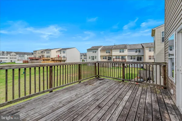 a view of an empty room with a ceiling fan
