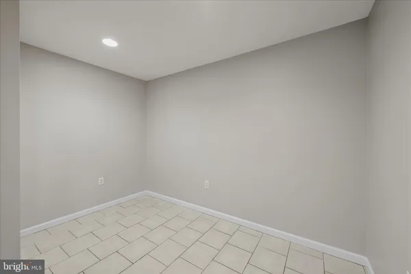 a aerial view of a house with a big yard and large trees