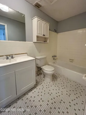 a bathroom with a sink toilet and vanity