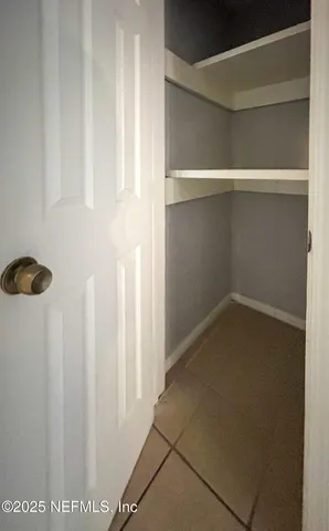 a view of small space with racks on the wall