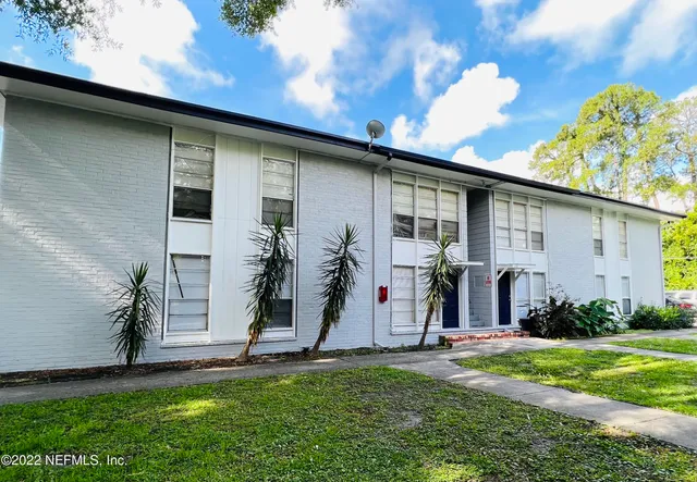 a view of a backyard with potted plants