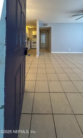 a view of a livingroom with an empty space and window