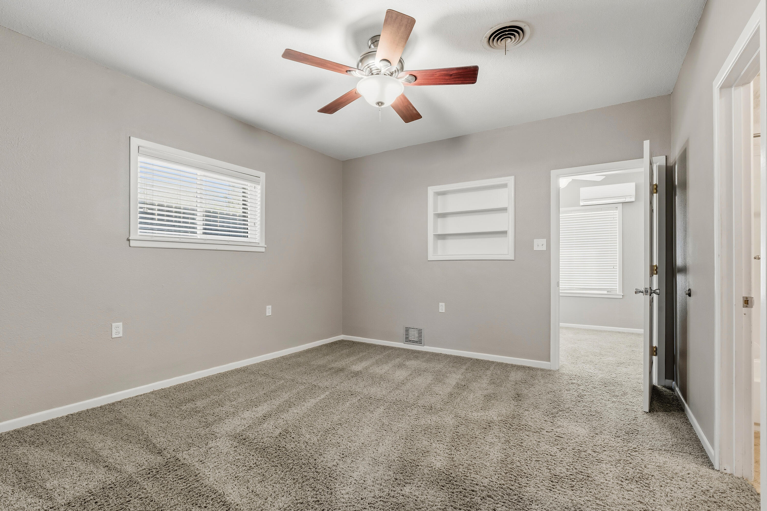 4831 10th Street Lubbock, TX 79416 - Photo 12 of 25 a view of an empty room with a window