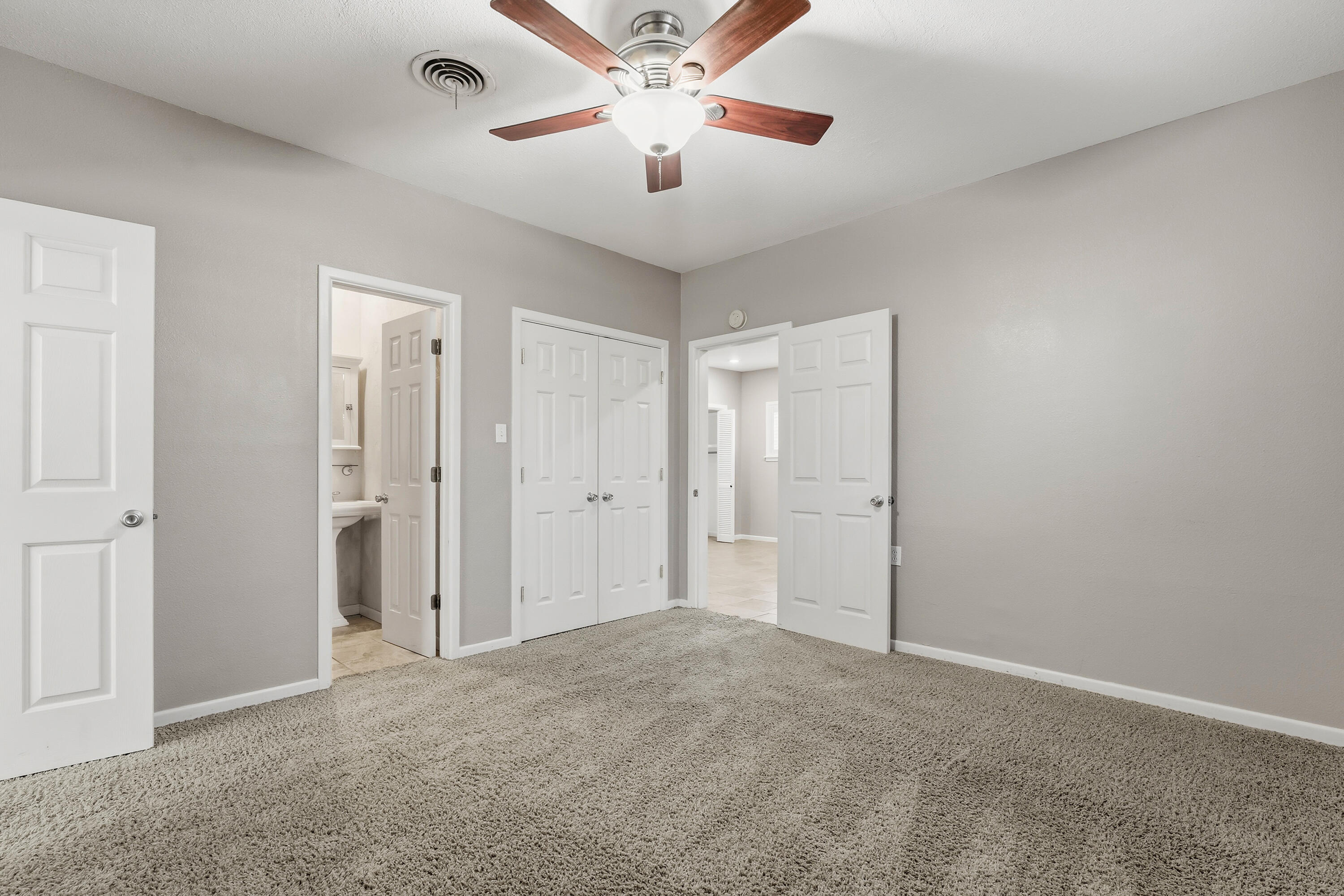4831 10th Street Lubbock, TX 79416 - Photo 13 of 25 a view of a livingroom with a ceiling fan and window